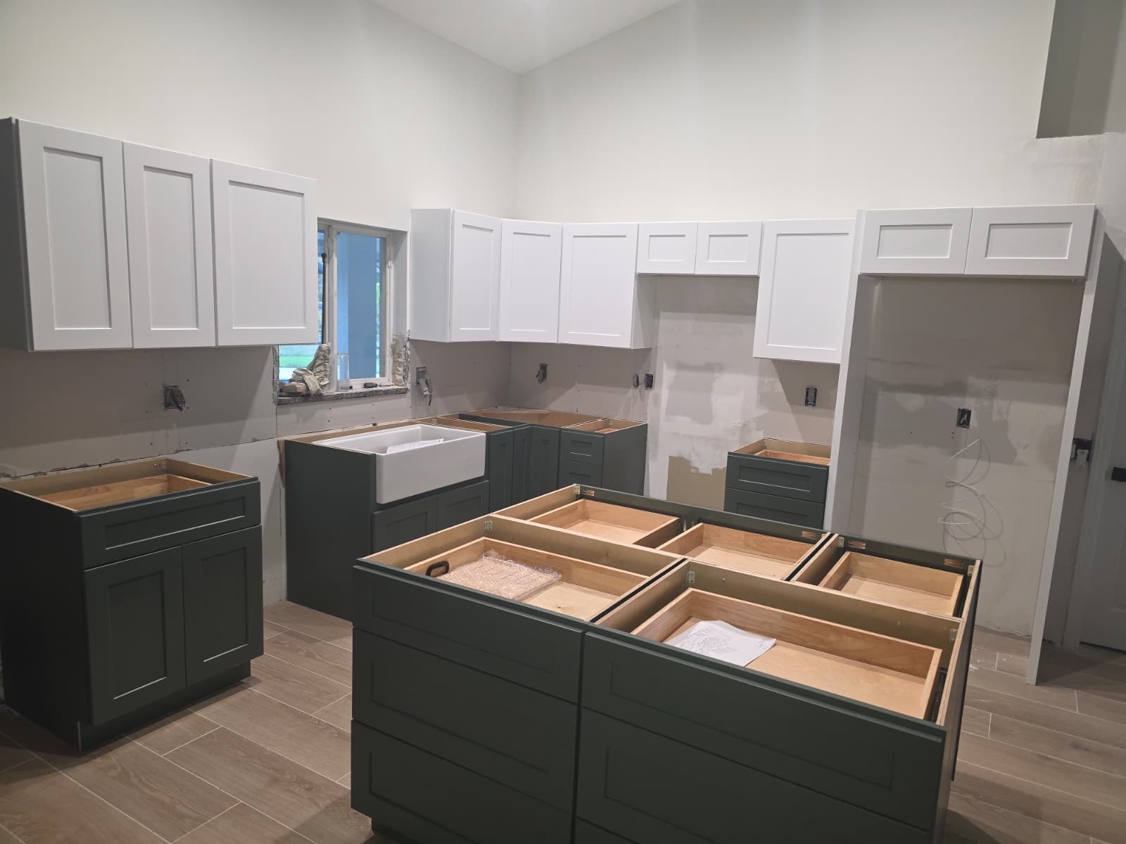 Kitchen renovation in progress — cabinet installation